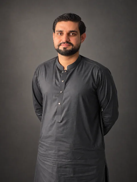 Portrait of Dr. Fayaz Khan, Head of Operations at JKN and a pharmacy graduate.